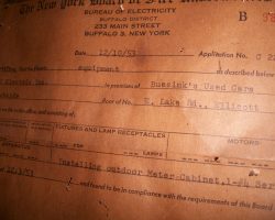 Sharyl Solsbee, owner of S.A.S. Motors, 3071 Fluvanna Avenue, Jamestown shared these relics of the location's connection to Julian Buesink. The electrical panel inside the office contains a certificate describing work done on the premises of "Buesink's Used Cars." The electrical panel inside the office contains a certificate describing work done on the premises of "Buesink's Used Cars."