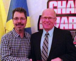 Former NASCAR driver Ernie Irvin congratulates
Dick Barton on receiving the Top Gun Award at the
Stateline Speedway banquet January 17, 2015.
Barton retired as the all-time late model feature winner in the history of Stateline Speedway. Former NASCAR driver Ernie Irvin congratulates Dick Barton on receiving the Top Gun Award at the Stateline Speedway banquet January 17, 2015. Barton retired as the all-time late model feature winner in the history of Stateline Speedway.