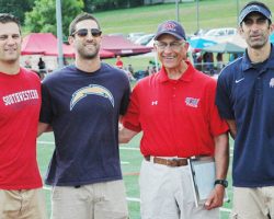 Fran Sirianni, second from right, stands with his sons, Mike,
Nick and Jay, on the athletic complex at Southwestern Central School that bears his name. May 2015.
<em>Post-Journal</em> (Jamestown) photo by Scott Kindberg. Fran Sirianni, second from right, stands with his sons, Mike, Nick and Jay, on the athletic complex at Southwestern Central School that bears his name. May 2015.