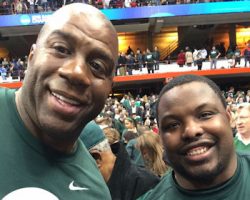 Jehuu Caulcrick, CSHoF Class of 2015 and Michigan State
grad, right, enjoyed the Spartans' NCAA Tournament victory
over Oklahoma on Friday, March 27, 2015, with another MSU
alum, Magic Johnson. Magic Johnson and Jehuu Caulcrick.