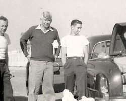 Lloyd Moore on far right unpacking his suitcase in the infield at Darlington Speedway (SC), 1952. Lloyd Moore on far right unpacking his suitcase in the infield at Darlington Speedway (SC), 1952.