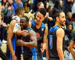 Jamestown’s Maceo Wofford is congratulated by teammates after leaving the game. Photo by Scott Reagle. <em>Post-Journal</em> (Jamestown), April 10, 2018. Jamestown’s Maceo Wofford is congratulated by teammates after leaving the game.