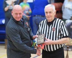Loren Smith, a modified boys and girls basketball coach at Panama, presents MacTavish with a plaque, 2019. Loren Smith, a modified boys and girls basketball coach at Panama, presents MacTavish with a plaque, 2019.