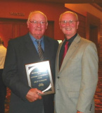 Skip Furlow (left), shown with Randy Anderson, receives Stateline Speedway Lifetime Achievement Award at 2012 Stateline banquet.