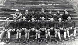 Salvatore "Jim" Foti, captain, holding ball with Jamestown High School football team, 1930.