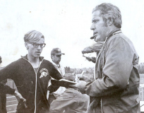 Former Post-Journal sportswriter Sherwood "Scrubby" Olson, right, chats with Southwestern Central School track and field star Brian Hull after a meet at Fredonia State College, 1973.