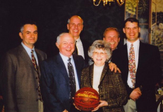 Martha Cooley, receiving a commemorative basketball from IAABO Board #39 for attending over 1,000 basketball games watching her husband Paul referee.