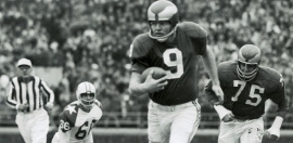 Jim McCusker is #75 behind quaterback Sonny Jurgeson #9 with the Philadelphia Eagles