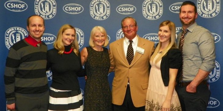 Charlie LaDuca standing with five family members at the induction banquet.