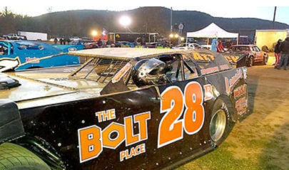 Dick Barton’s car sits with his helmet in the driver’s side window.