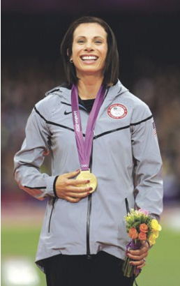 Fredonia native Jennifer Suhr poses with her gold medal for the women's pole vault in the Olympic Stadium at the 2012 Summer Olympics in London.