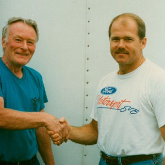 Bobby Schnars shakes Dick Barton's hand.