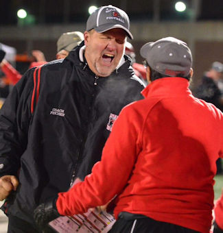 Maple Grove head coach Curt Fischer celebrates with assistant coach Dan Greco.