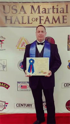 Mark Weaver is pictured with his Kung-Fu Master of the Year award.