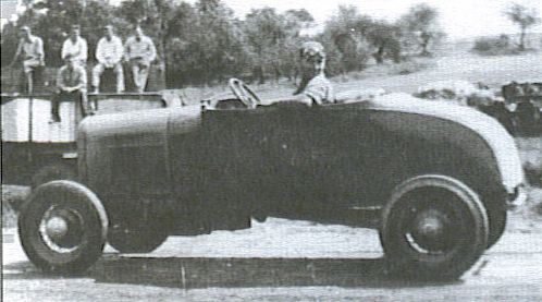Lloyd Moore in race car.