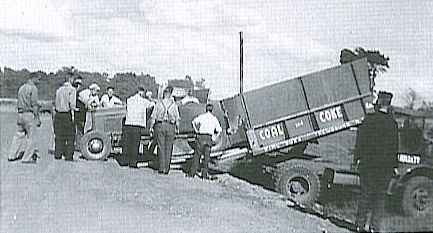 Lloyd Moore unloading race car.