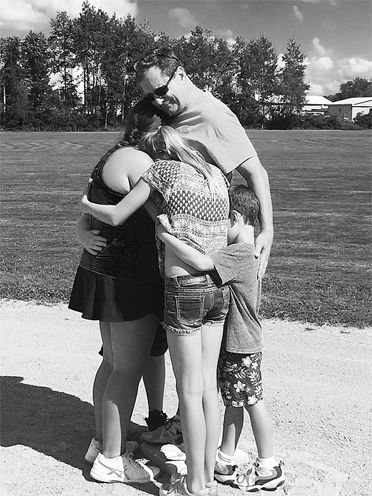 Olsen family embrace.