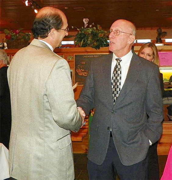 Dan Lunetta and Tom Priester shake hands.