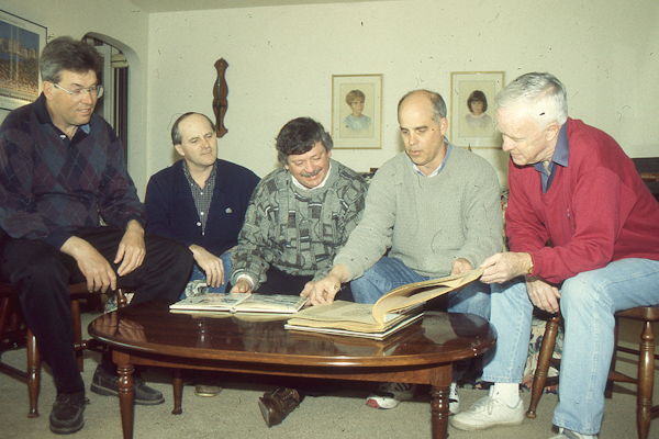 Bemus Point High School alumni look over yearbook.