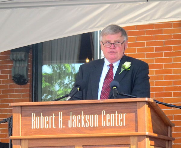Greg Peterson addresses a packed crowd.