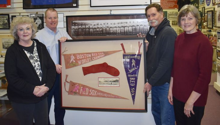 Hugh Bedients grandchildren present memorabilia to the CSHOF.