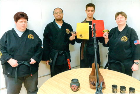 Malahki Schroder of Kebort’s Karate Tigers, second from the right, recently was promoted to the rank of First Degree Blackbelt.