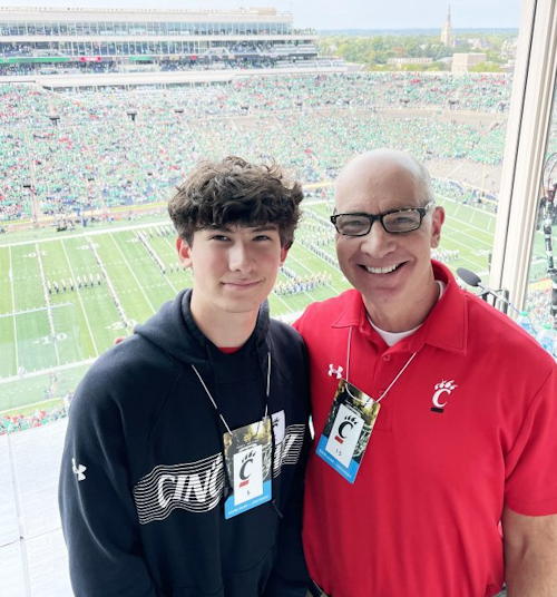 Dan Hoard poses for a photo with his son, Sam.