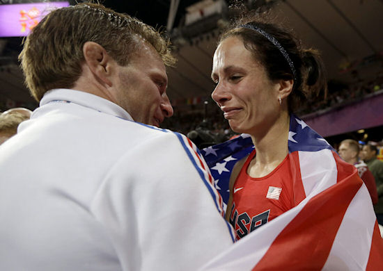 Jenn Suhr is congratulated by her husband and coach, Rick.
