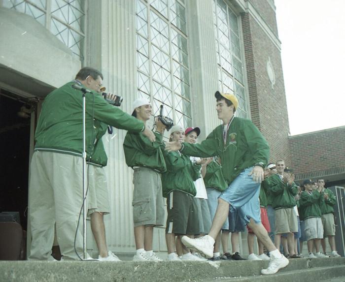 Denny Meszaros shakes the hand of Sam Marra.