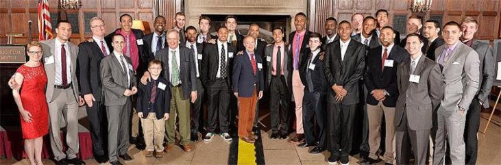 Jamestown native Kirsten Green, far left, with the Harvard men’s basketball team and staff.