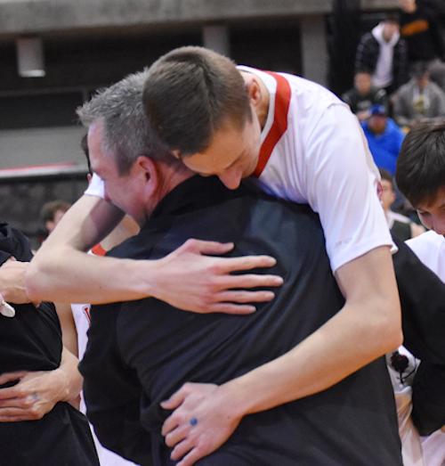 Salamanca’s Andy Herrick shares an embrace with his father.