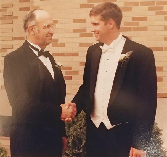 Bill Price shares a special moment with his father, Russ.