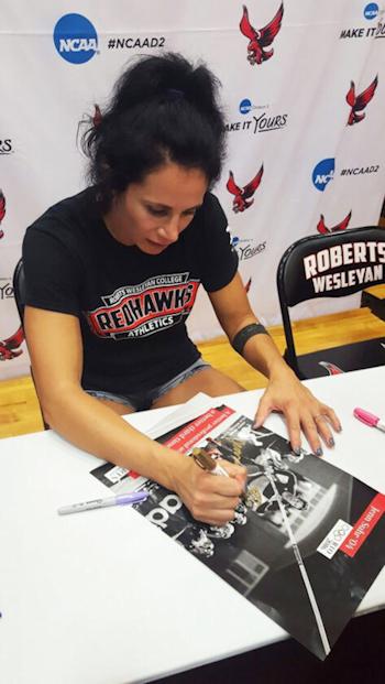 Jennifer Suhr signs an autograph.