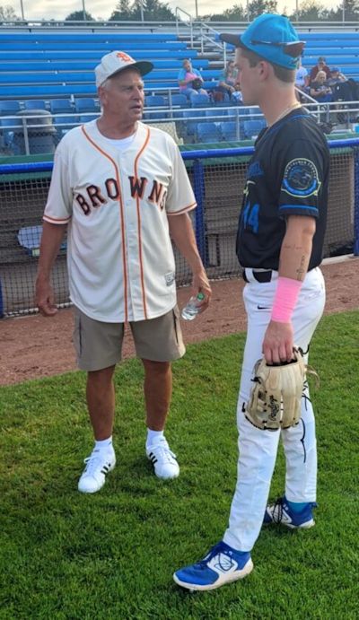 Tom Brown speaking with Jamestown Tarp Skunk’s ball player, DJ Stoianovich.