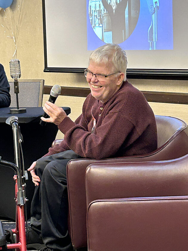 Tom Anderson laughs as he responds to a question.
