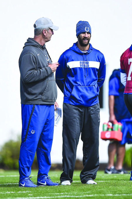 From left, Frank Reich talks with Nick Sirianni.