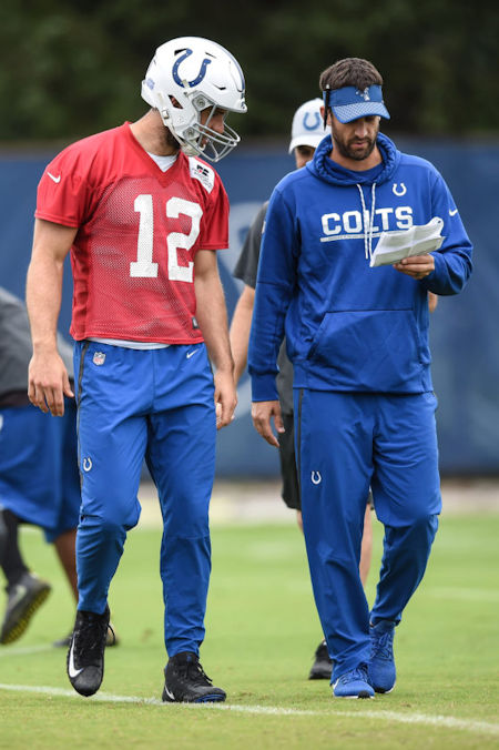 From left, Andrew Luck talks with Nick Sirianni.