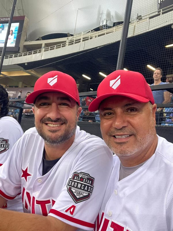 Anthony Barone with pitching coach Hector Berrios.