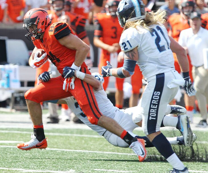 Stephen Carlson running the football.
