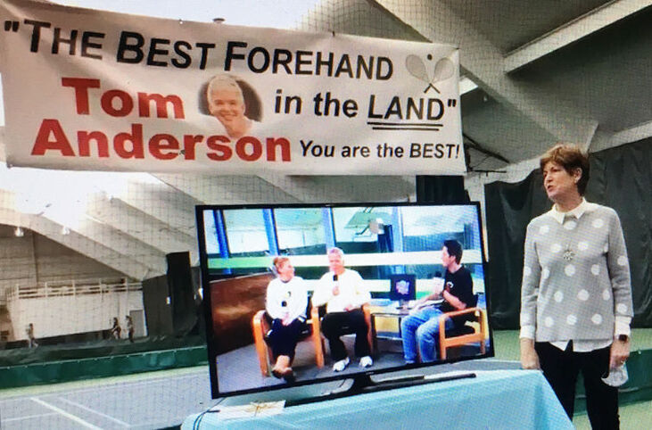 Holly Sullivan announces that the tennis courts at the Lakewood YMCA will be named in honor of branch manager Tom Anderson.
