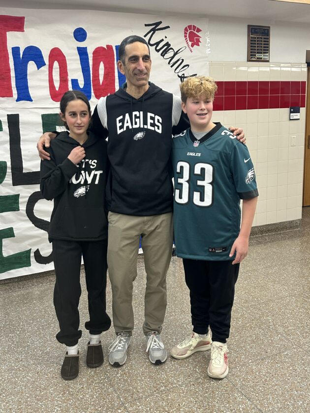 Jay Sirianni, a Southwestern Central School social studies teacher and coach, is pictured with his daughter Gianna and a fellow student. 