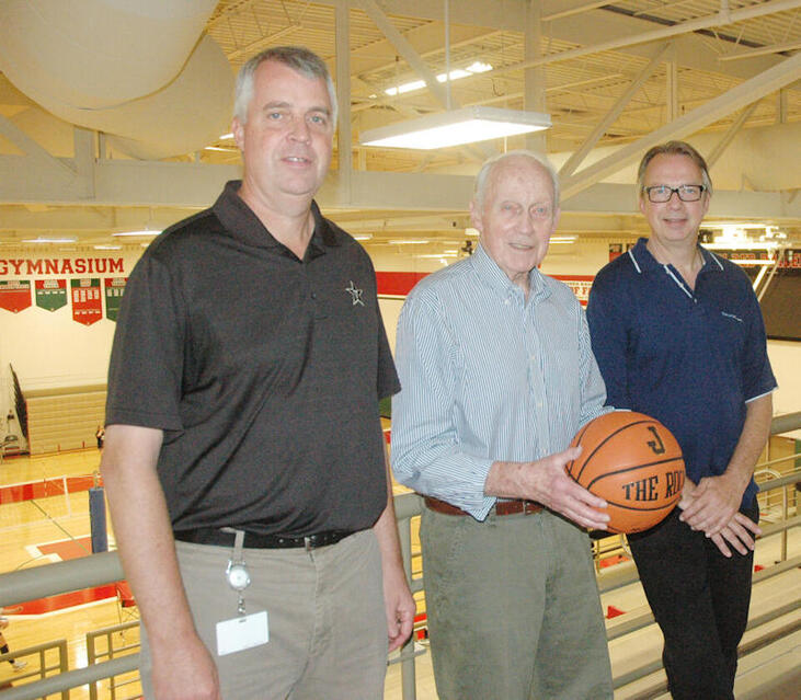 im McElrath Sr., middle, is flanked by his sons Mike, left, and Jim Jr.