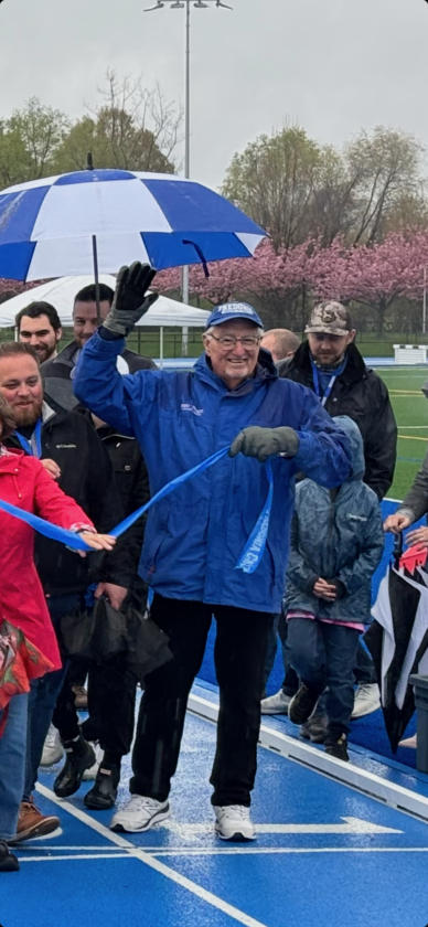 Former Fredonia State track & field head coach Jim Ulrich was all smiles during the ribbon cutting. 