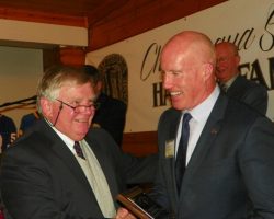 Greg-Peterson-accepting-for-Peter-Mueller