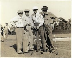 Howard Ehmke, second from right, checking the scorecard.