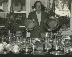 Bob Gunnell displays evidence of his accomplishments.