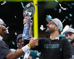 Nick Sirianni hoists the Lombardi Trophy after winning Super Bowl LIX.