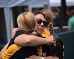 Brianne Prince Hazelton hugs one of her players, 2025.