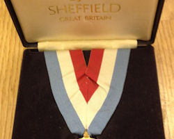 Also among the items is a gold medal from the 1991 World University Games.