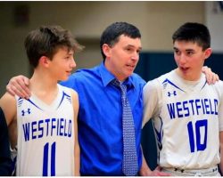 Westfield head coach Nolan Swanson shares a moment with his sons Carson (11) and Darien (10). March 2 2022.